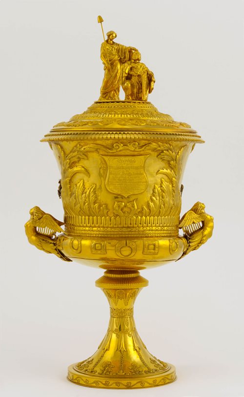 Gold cup with two figures on lid